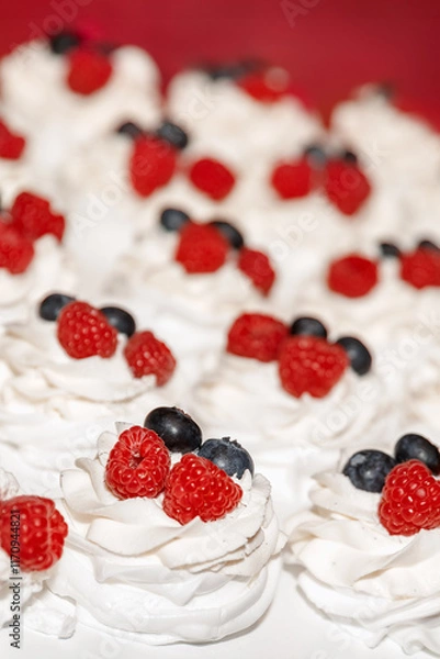 Fototapeta Mini pavlova meringue cake with fresh raspberry
