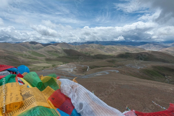 Obraz Colorful prayer flags flutter above serpentine road across Pang La Pass (5,200m) which is the last pass before reaching Mount Everest Base Camp, between Shigatse and Rongbuk, Tibet, China