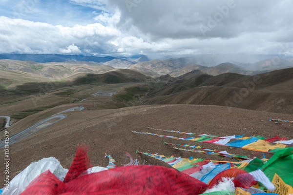 Obraz Colorful prayer flags flutter above serpentine road across Pang La Pass (5,200m) which is the last pass before reaching Mount Everest Base Camp, between Shigatse and Rongbuk, Tibet, China