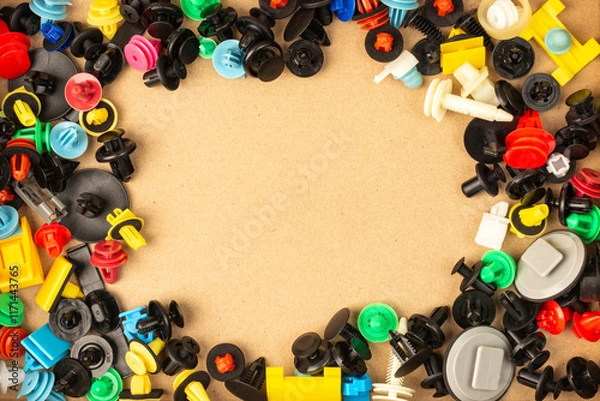 Fototapeta Close-up of plastic colored clips for car.Abstract background. Panel plastic rivets, Auto plastic clips.