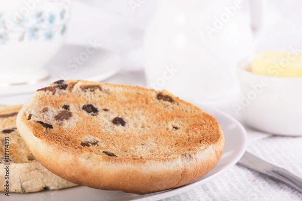 Obraz Tea with a traditional British teacake of raisins, sultanas and