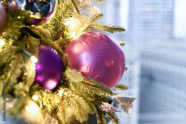 Fototapeta Christmas tree ornaments hanging on the branches