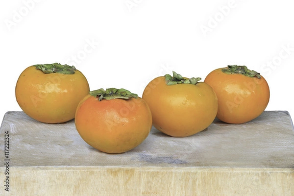 Fototapeta persimmon on wooden cutting boards isolate on white background