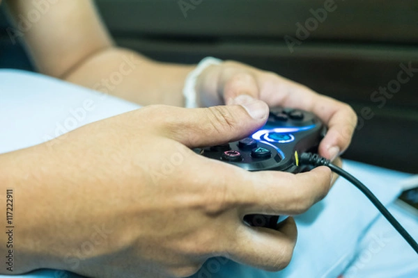 Fototapeta gamepad in hand