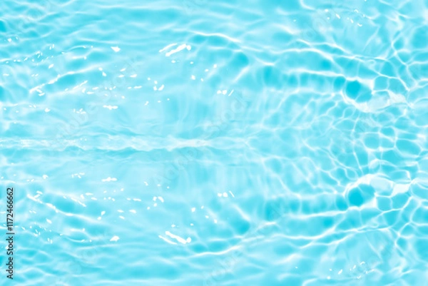 Fototapeta Blue water with ripples on the surface. Defocus blurred transparent blue colored clear calm water surface texture with splashes and bubbles. Water waves with shining pattern texture background.