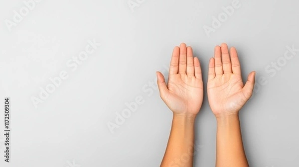 Fototapeta Hands Reaching Up in Gesture of Hope and Positivity Against Light Gray Background for Creative Use