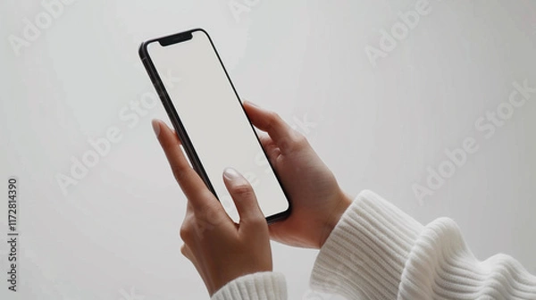 Fototapeta Woman  hands holding a smartphone while scrolling
