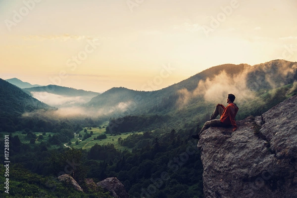 Obraz Explorer man enjoying view of sunset