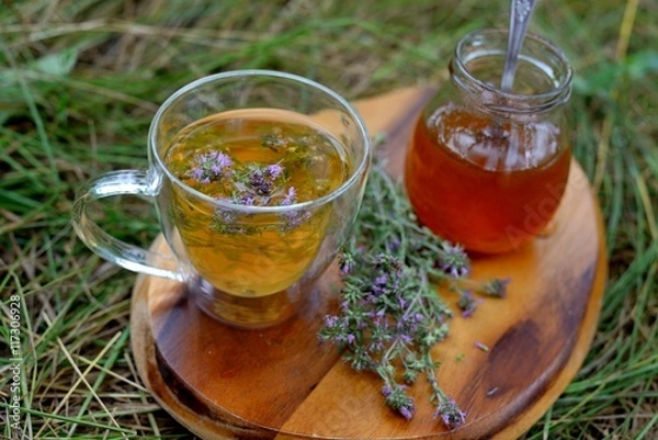 Fototapeta Tea with wild thyme and honey