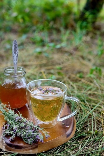 Fototapeta Tea with wild thyme and honey