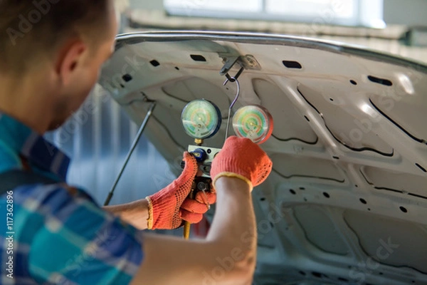 Obraz Auto mechanic worker in garage.