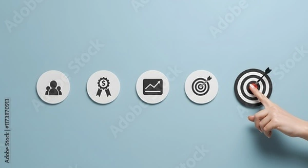 Fototapeta Business icons aligning for finance, growth, and target achievement showing hand selecting dartboard for focus and goal strategy on clean blue background