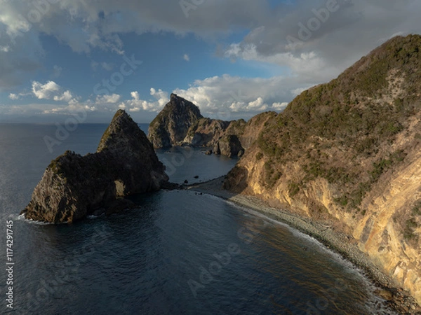 Fototapeta 夕陽があたる洗顔門ビーチ