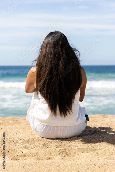Fototapeta Panorama of beach in Jalisco, Mexico with a person watching the sea in the morning, it seems that the woman is enjoying the tranquility while meditating