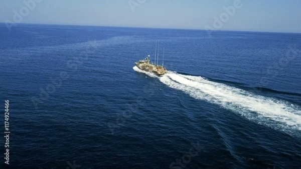 Fototapeta drone view - coast guard boat at sea on patrol