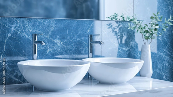 Fototapeta Elegant blue and white bathroom with oval marble double sinks and modern faucets