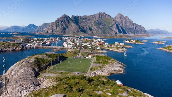 Fototapeta Aerial view of Henningsvaer typical norwegian village on a fjordn with in a summer day