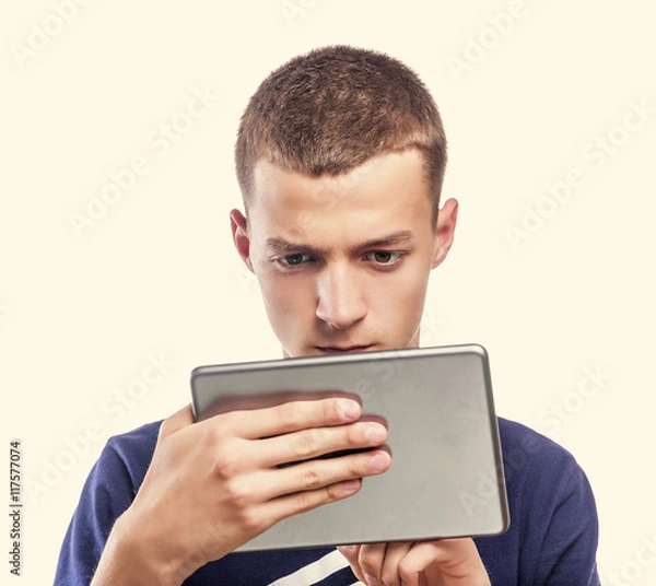 Fototapeta Young man using tablet pc