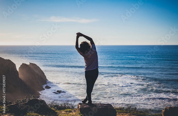 Fototapeta person exercising and enjoying walking on the Algarve west coast beach