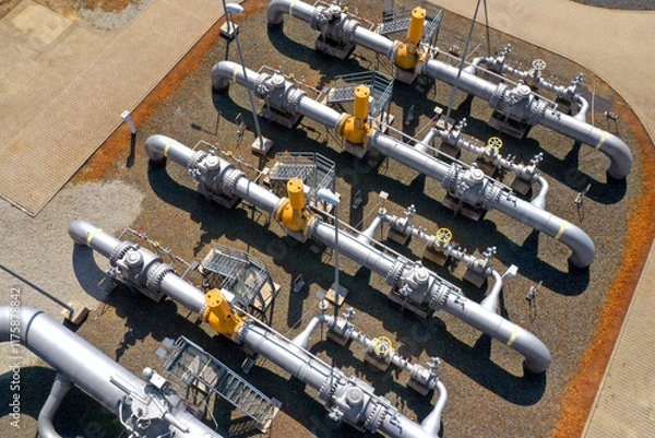 Fototapeta Natural gas pipeline in European Union. High pressure pipes on a hot summer day.

