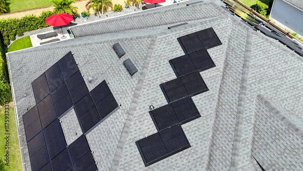 Obraz A home with solar panels on the roof in a neighborhood in Orlando, Florida