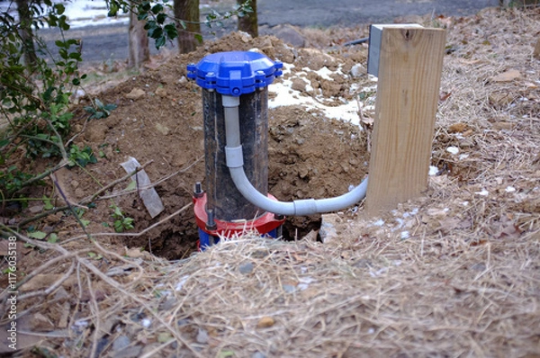 Fototapeta fixing a private well on house property