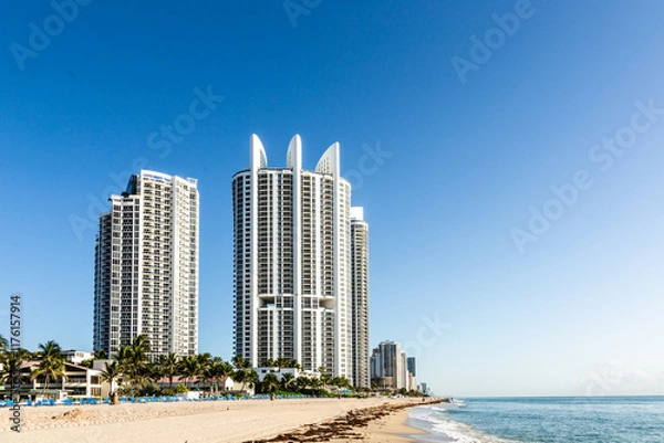 Fototapeta scenic view to skyscraper and beautiful beaches at Sunny Isles Beach. It is a city located in Miami County,