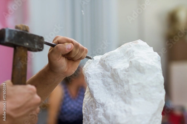 Obraz Man carving stone statue