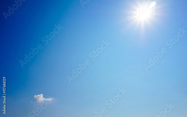Obraz blue sky background with sun light Flare