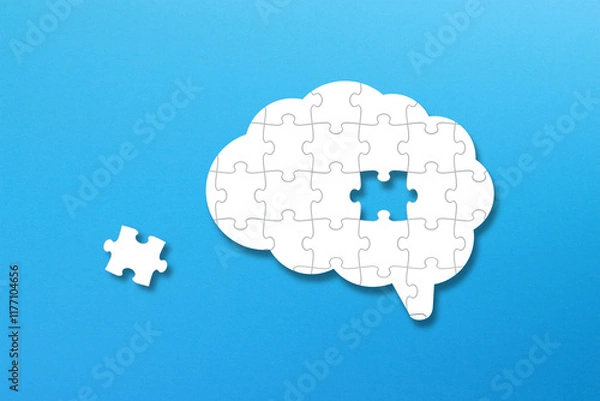 Fototapeta Brain shaped white jigsaw puzzle on blue background. A missing piece of the brain puzzle. Mental health and problems with memory.