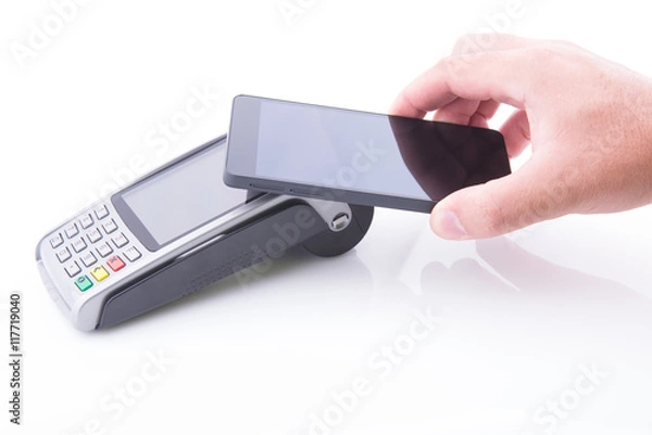 Obraz Hand with a smartphone on a POS