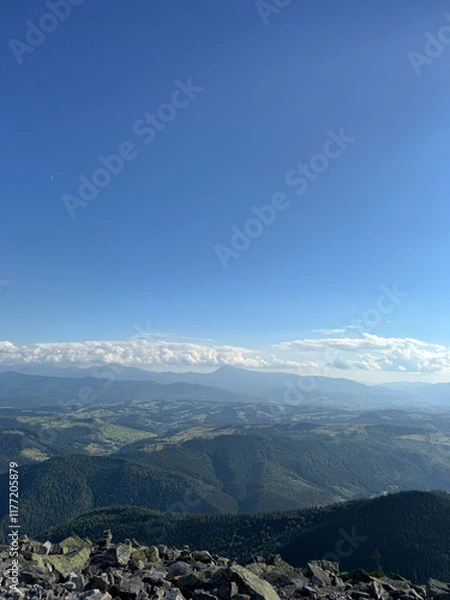 Fototapeta Top view of mountains. Colorful panorama of the mountain, green hills, low clouds, clouds over the mountain. Nature scene of pine trees of Carpathian mountains