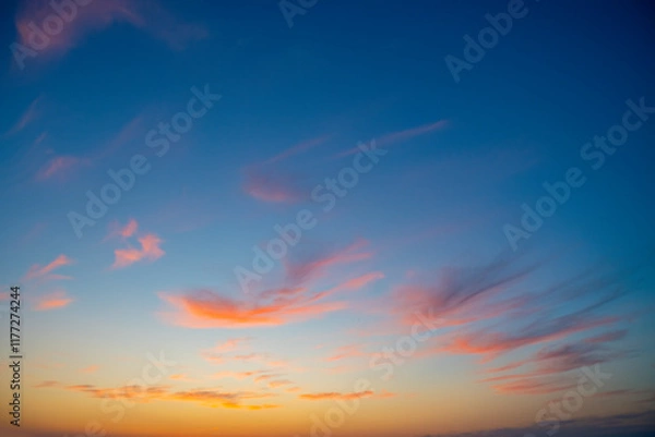 Fototapeta Blue sky at sunset. Pink and yellow horizon. Romantic travel background with empty space for text.