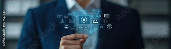 Fototapeta A businessman interacts with digital icons, showcasing technology and innovation in a modern office environment.