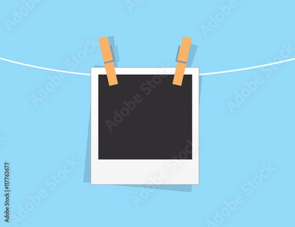 Fototapeta Single blank photo hanging from string
