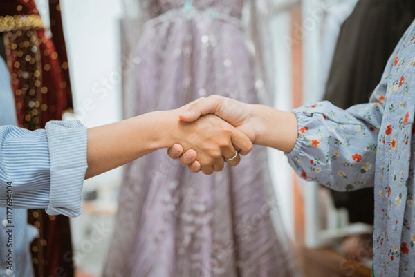 Obraz In a stylish boutique setting, a handshake serves as a powerful symbol of agreement and connection