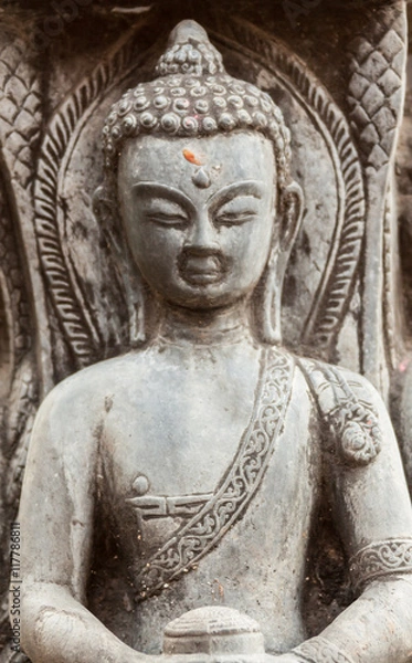 Fototapeta A stone carving of a buddha in Nepal.