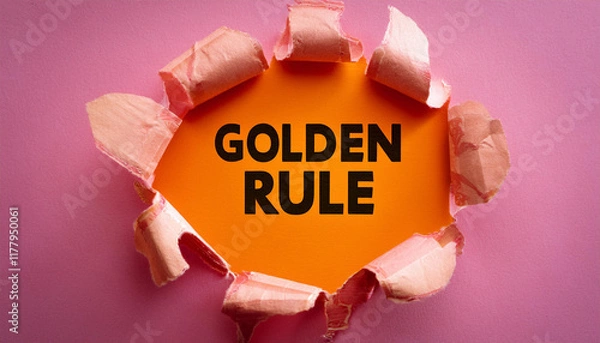 Obraz golden rule message written on ripped torn pink paper piece with orange heritage conceptual golden rule symbol replica space
