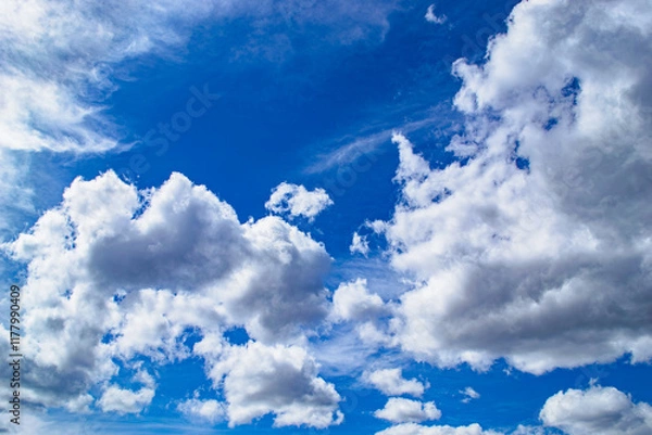 Obraz Magnificent cumulus clouds high in blue sky