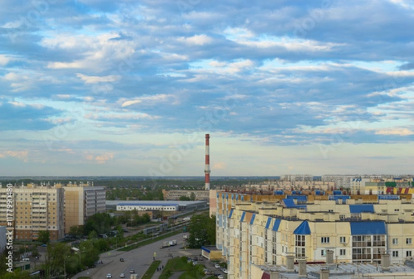 Obraz Top view of the town with many multi-storey buildings under a cloudy sky