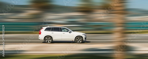 Fototapeta Banner with a fast-moving white car on a speed-blurred background.