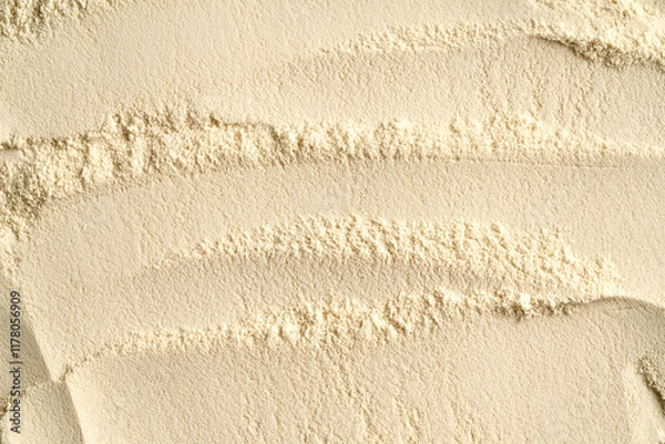 Fototapeta Whey protein powder as textured background, top view