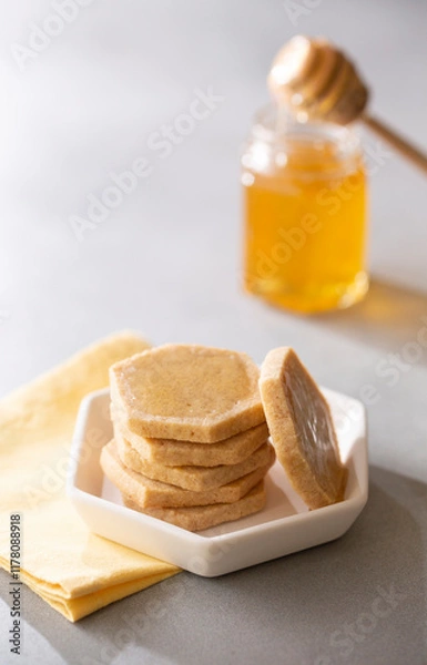 Obraz Honey Shortbread Cookies, Biscuits, cut into hexagon shape with honey jar and dipper