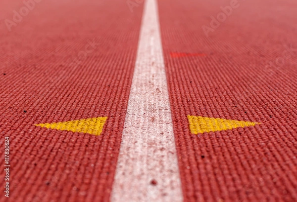 Fototapeta Abstract image of track and field track. Track and field running line. Running relay race track. Symmetrical image of running track. Abstract design and art. Modern art and design.