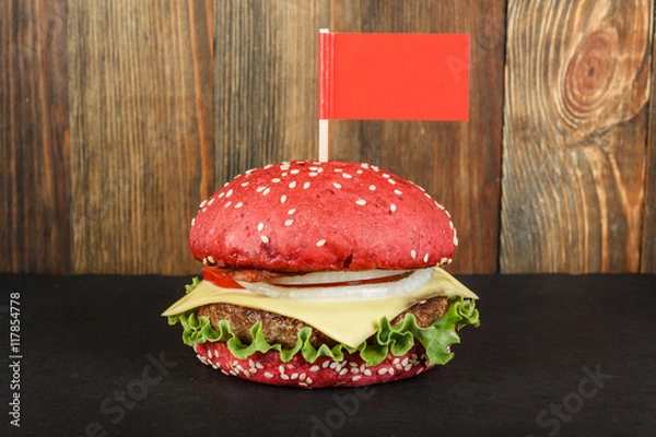 Obraz Red cheeseburger with flag close-up