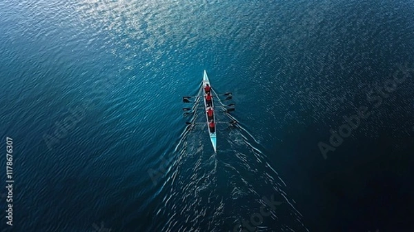 Fototapeta Aerial view of a rowing team in sync, gliding through tranquil waters, showcasing teamwork and athleticism.