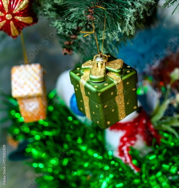 Obraz Christmas toys on an artificial Christmas tree close-up