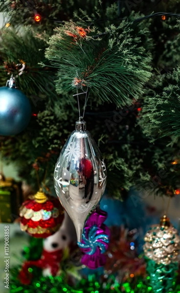 Obraz Christmas toys on an artificial Christmas tree close-up