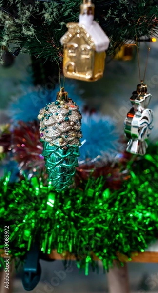 Obraz Christmas toys on an artificial Christmas tree close-up
