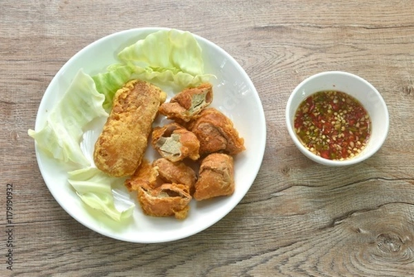 Fototapeta fried slice Vietnamese chicken sausage recipe with cabbage on plate dipping spicy sauce